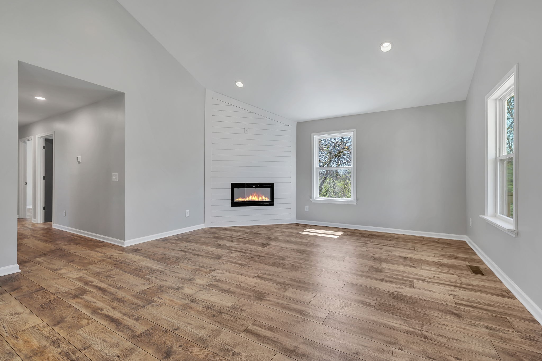 127 Lock 6 Road Hartsville, TN 37074 - Photo 10 of 35 a view of an empty room with window and wooden floor