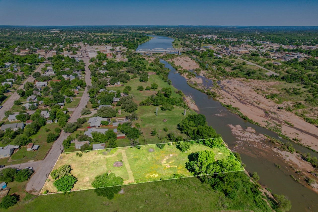 609 East Main Street Llano, TX 78643 - Photo 1 of 23 a view of a garden with a building in the background