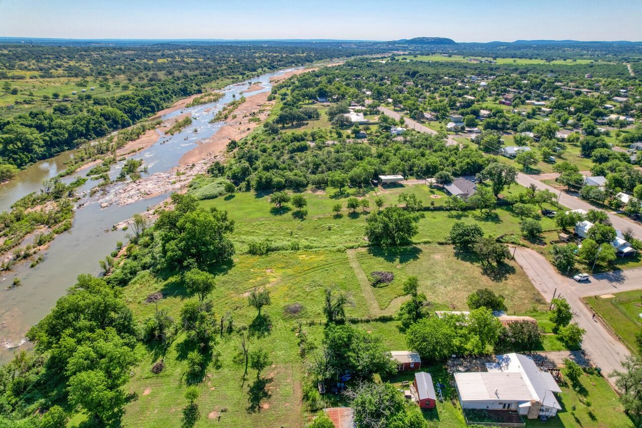 609 East Main Street Llano, TX 78643 - Photo 12 of 23 an aerial view of residential houses with outdoor space and trees