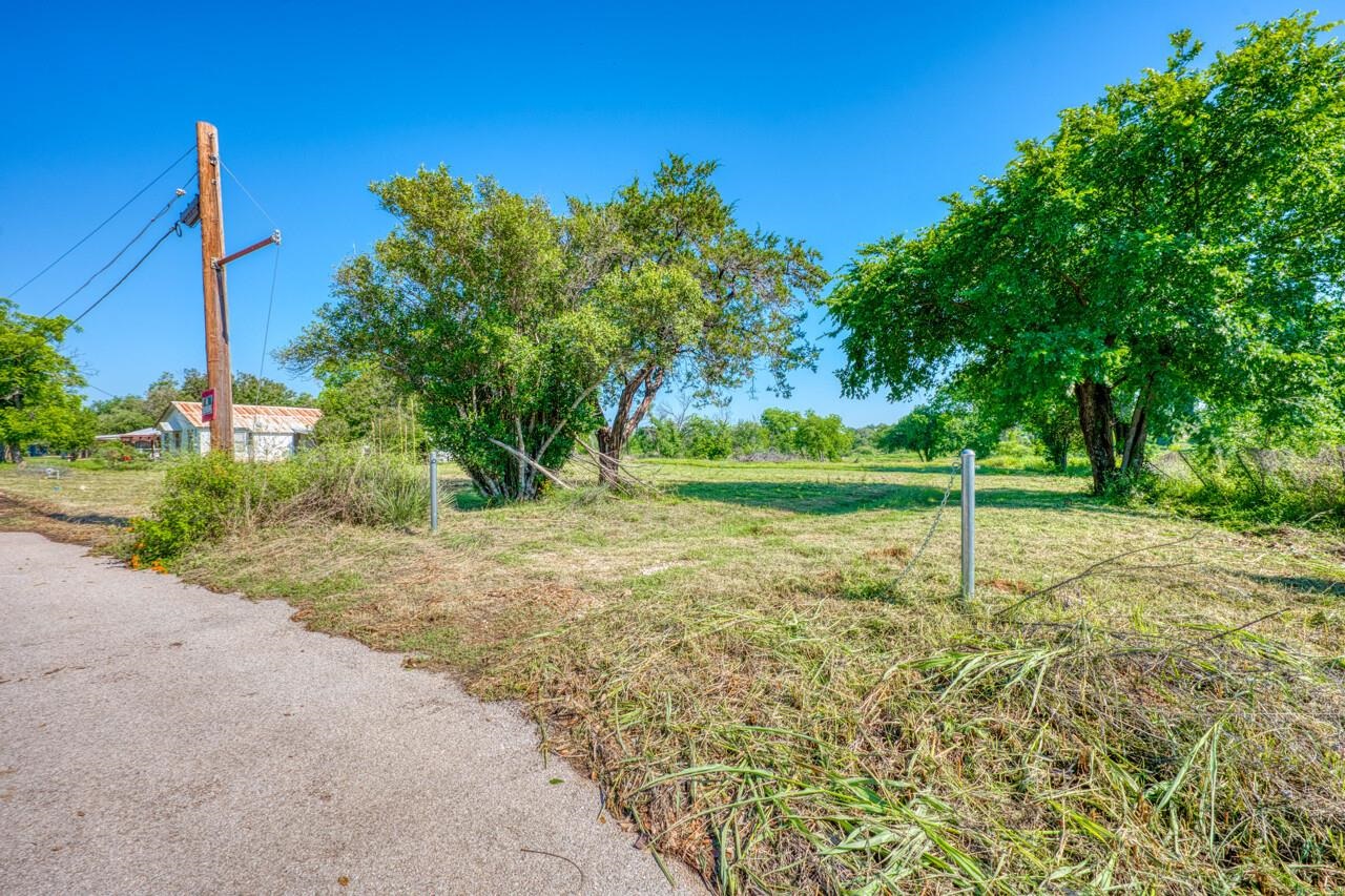 609 East Main Street Llano, TX 78643 - Photo 17 of 23 a view of a yard with a tree