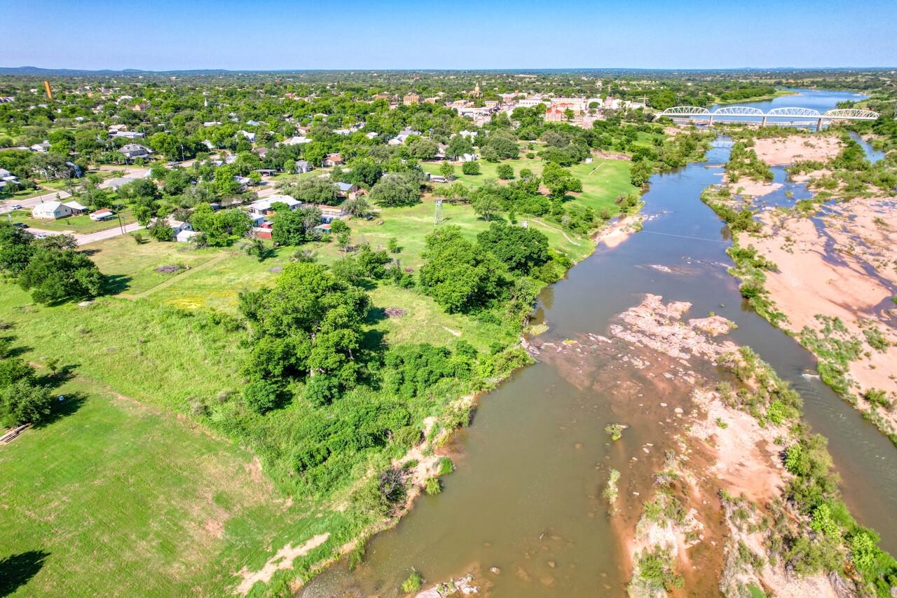 609 East Main Street Llano, TX 78643 - Photo 6 of 23 a view of a street with a yard