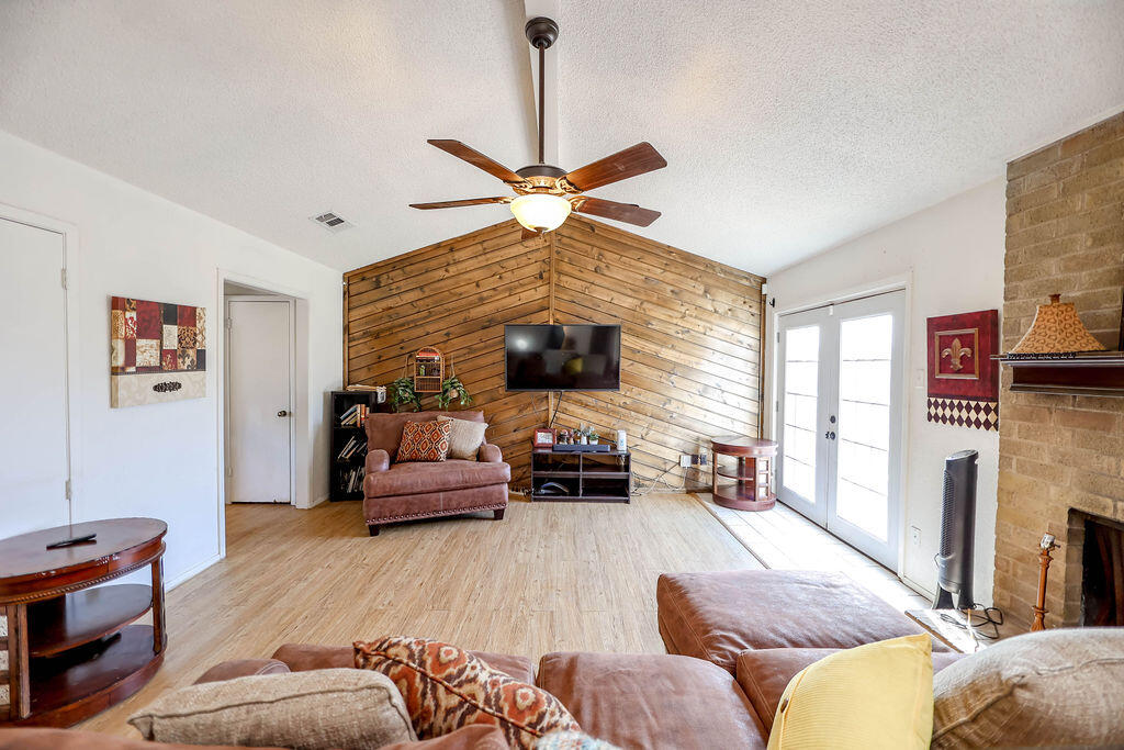 6001 14th Street Lubbock, TX 79416 - Photo 15 of 31 a living room with furniture and a fireplace