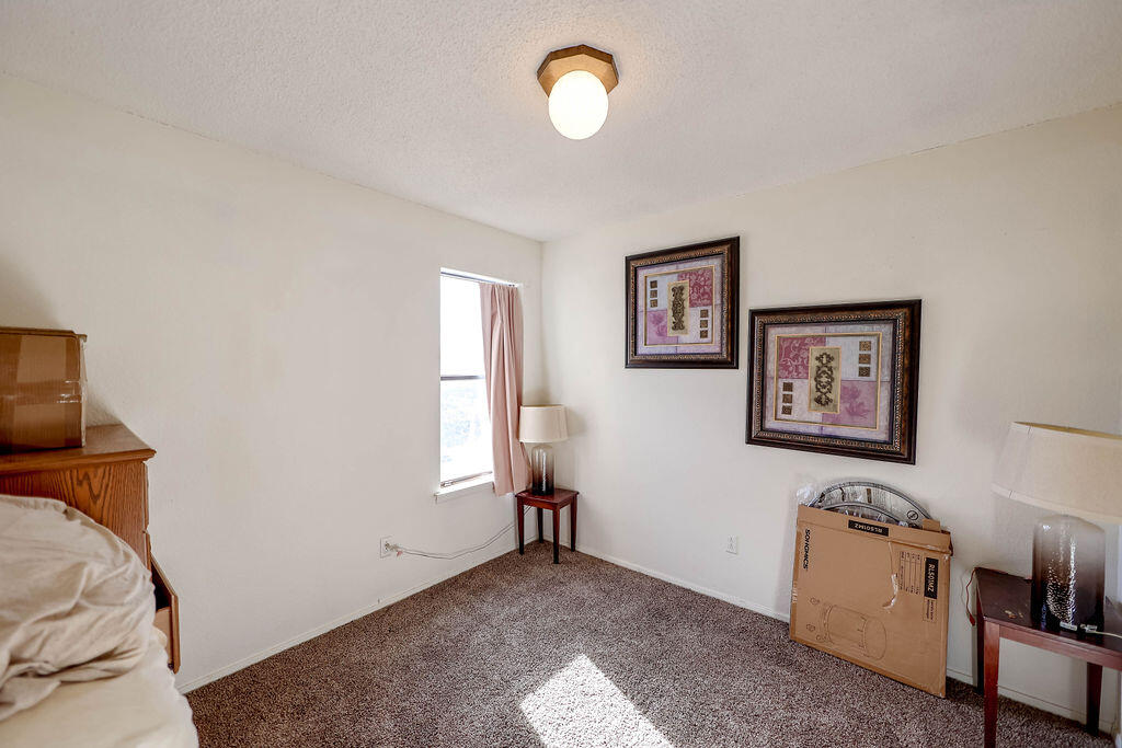 6001 14th Street Lubbock, TX 79416 - Photo 20 of 31 a view of a room with window and a ceiling fan