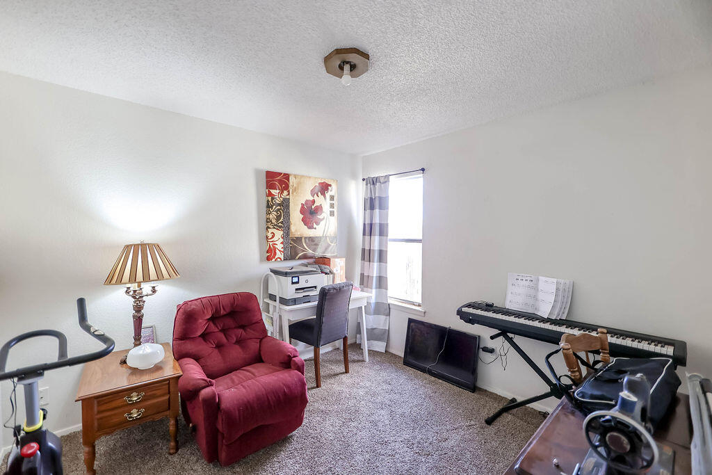 6001 14th Street Lubbock, TX 79416 - Photo 22 of 31 a livingroom with furniture and a window