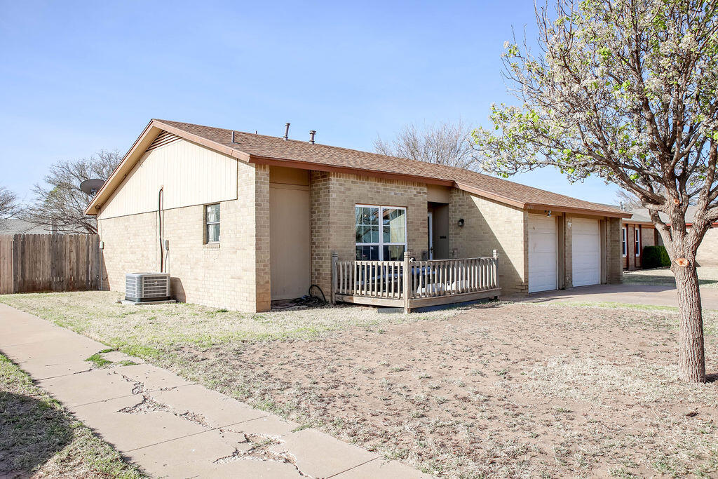 6001 14th Street Lubbock, TX 79416 - Photo 3 of 31 a view of a house with a patio