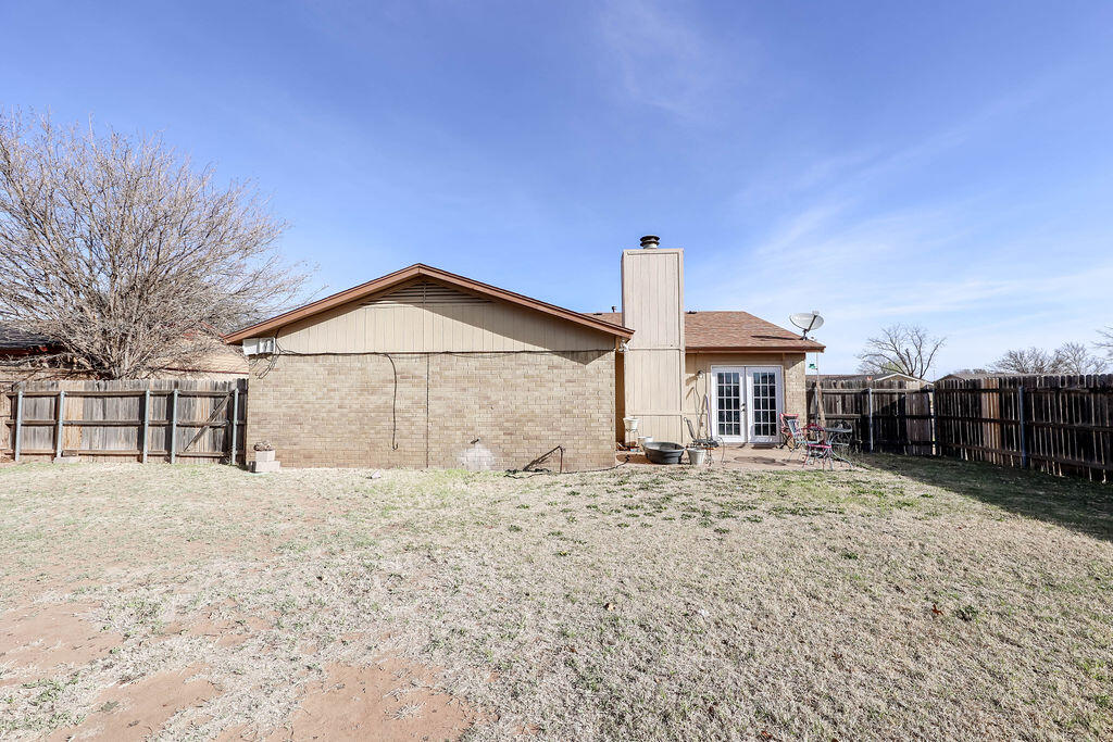 6001 14th Street Lubbock, TX 79416 - Photo 31 of 31 a front view of a house with a yard and garage
