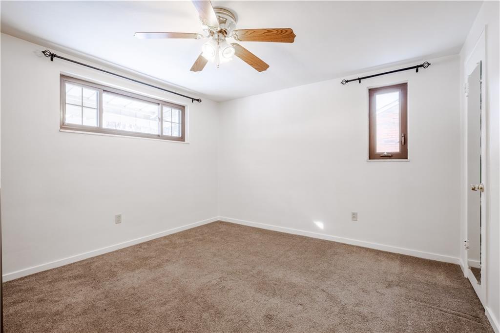 435 Pearce Road Pittsburgh, PA 15234 - Photo 13 of 25 an empty room with windows and fan