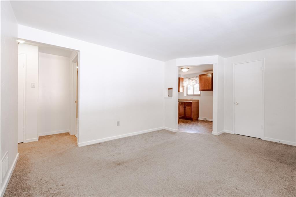 435 Pearce Road Pittsburgh, PA 15234 - Photo 4 of 25 a view of empty room with a fireplace and window