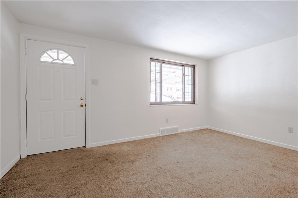 435 Pearce Road Pittsburgh, PA 15234 - Photo 5 of 25 an empty room with windows and closet