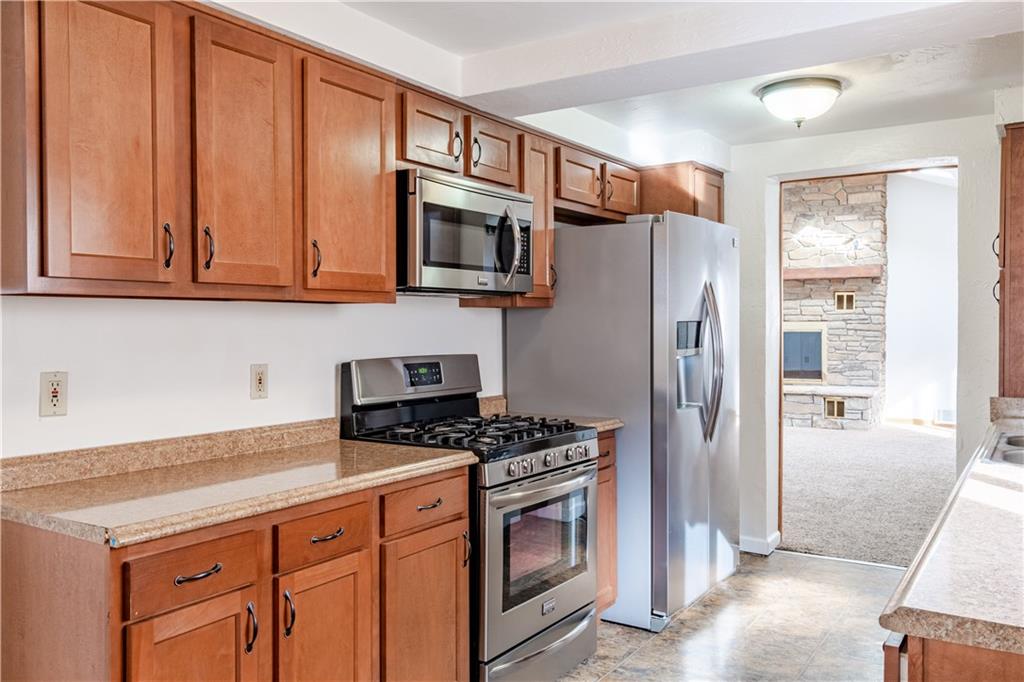 435 Pearce Road Pittsburgh, PA 15234 - Photo 7 of 25 a kitchen with stainless steel appliances granite countertop a refrigerator stove and sink