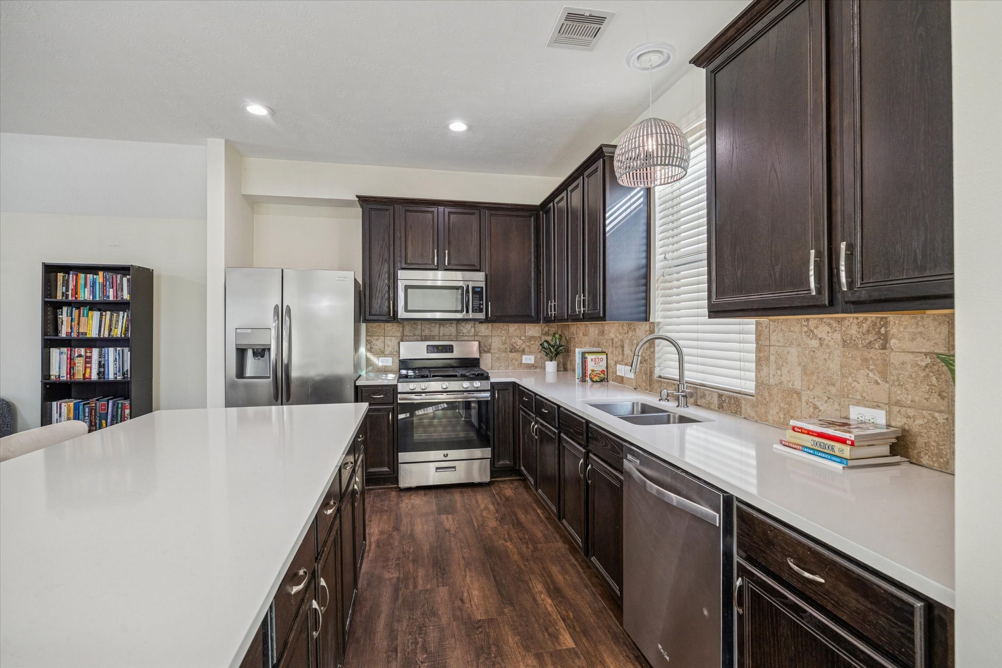3332 Home Point Drive Houston, TX 77091 - Photo 11 of 26 a kitchen with stainless steel appliances a refrigerator sink and cabinets