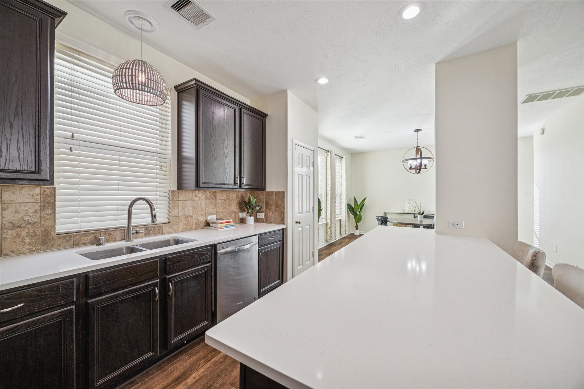 3332 Home Point Drive Houston, TX 77091 - Photo 12 of 26 a large white kitchen with a sink and cabinets