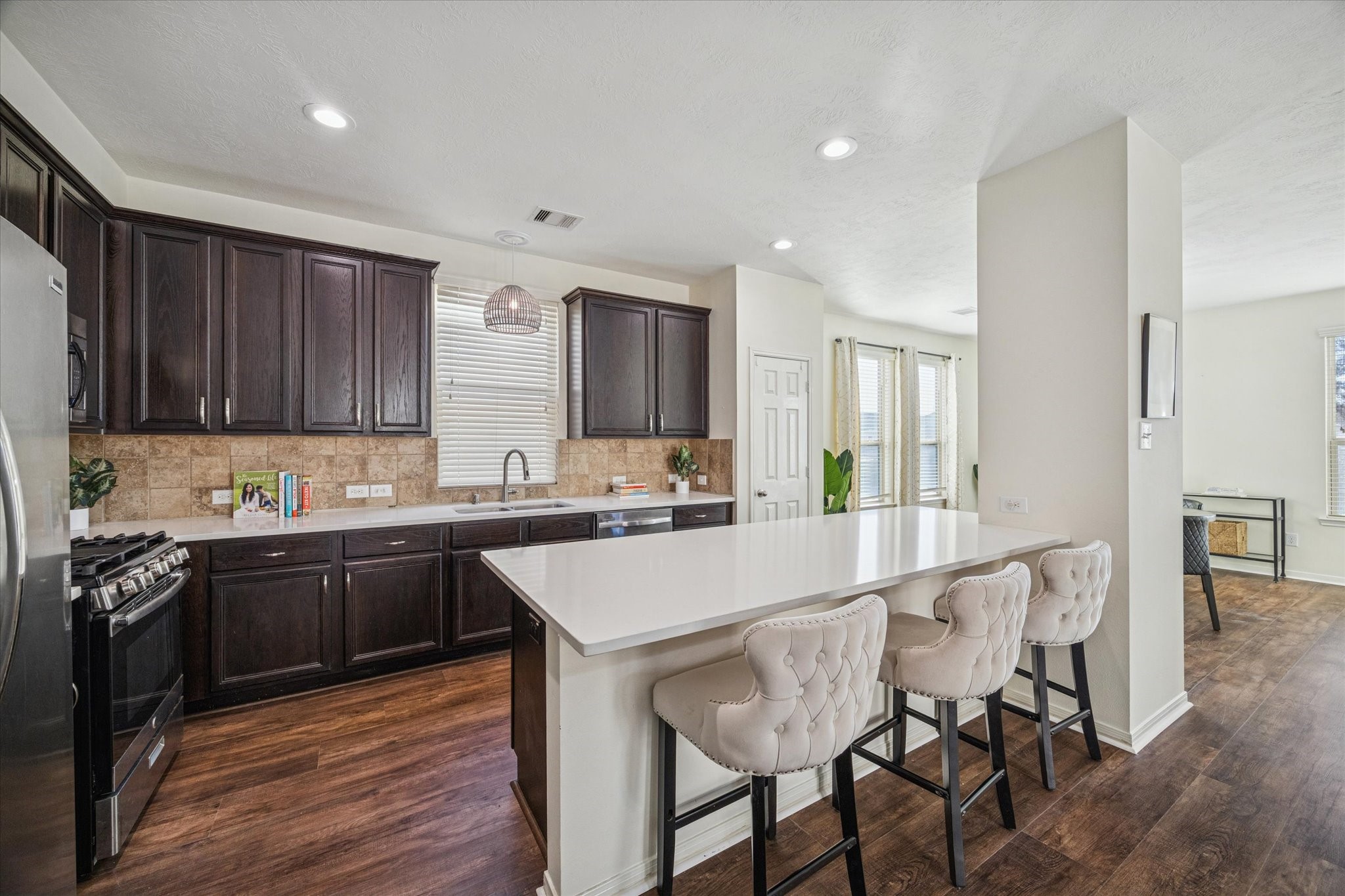 3332 Home Point Drive Houston, TX 77091 - Photo 13 of 26 a large kitchen with lots of counter space a sink and appliances