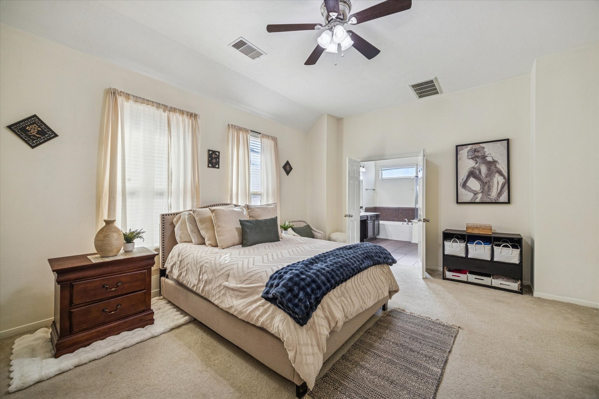 3332 Home Point Drive Houston, TX 77091 - Photo 16 of 26 a bedroom with a bed lamp and paintings on the wall