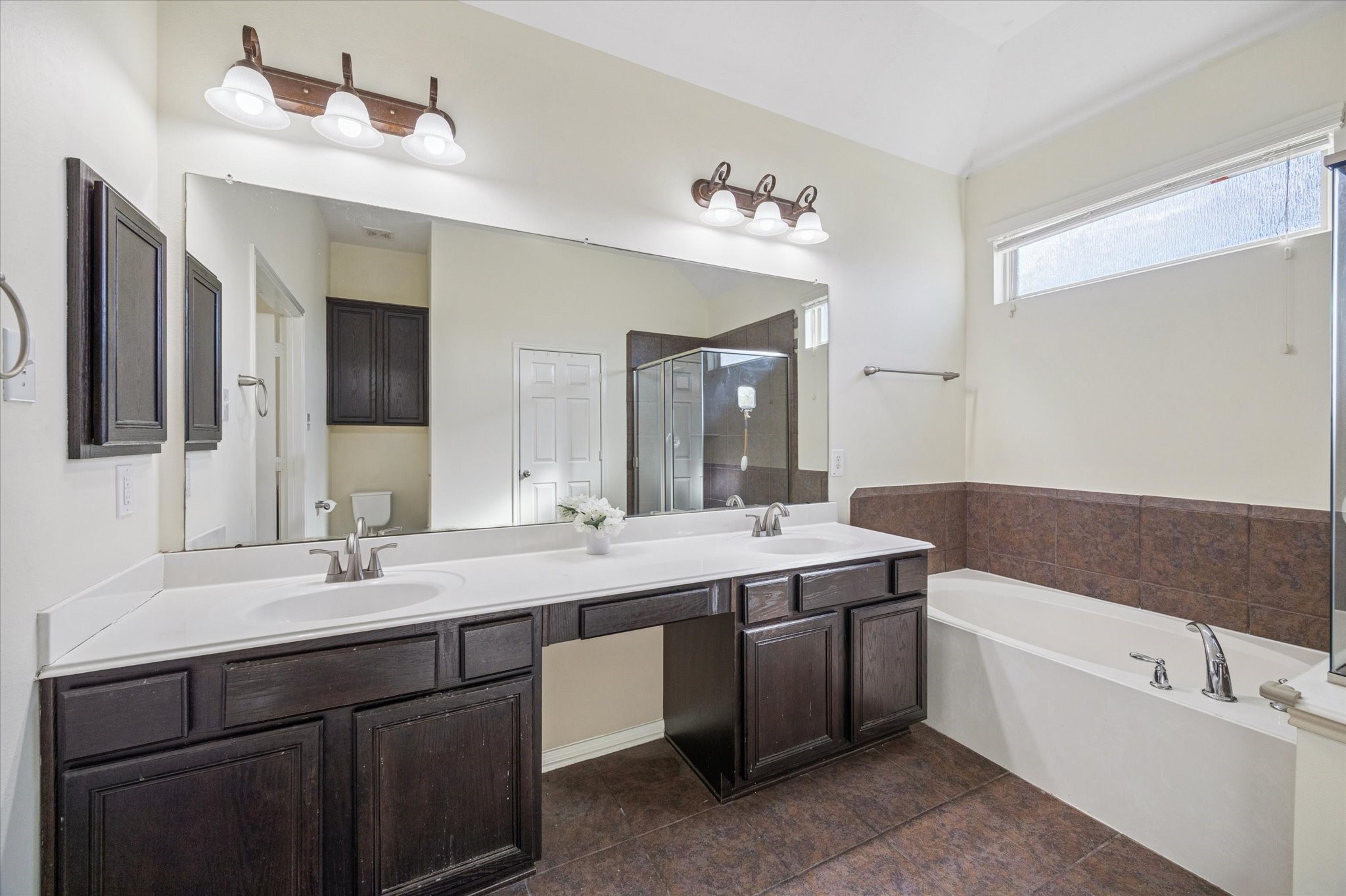 3332 Home Point Drive Houston, TX 77091 - Photo 18 of 26 a bathroom with a sink double vanity granite tub and a mirror