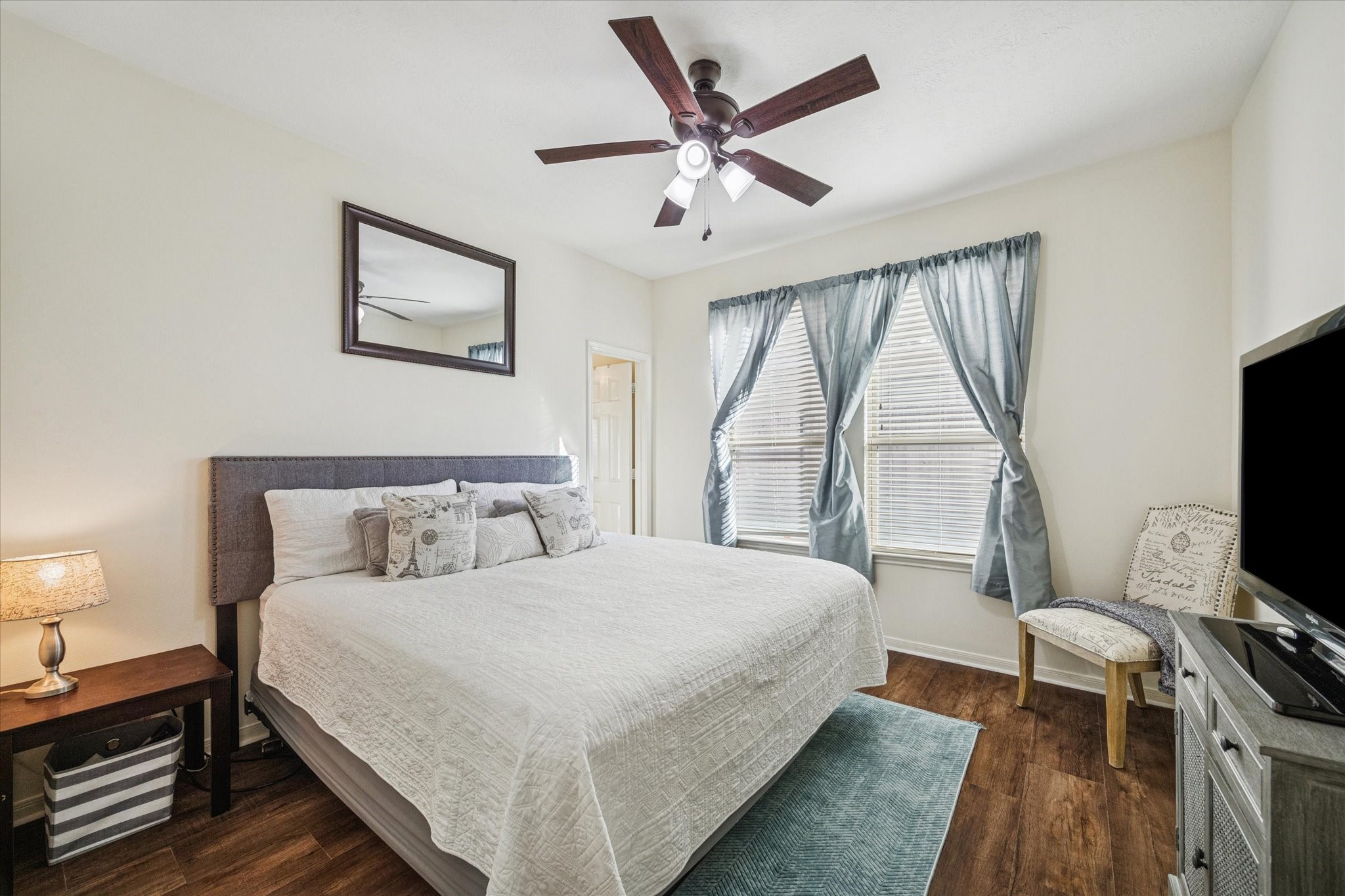 3332 Home Point Drive Houston, TX 77091 - Photo 20 of 26 a bedroom with a bed and a flat screen tv