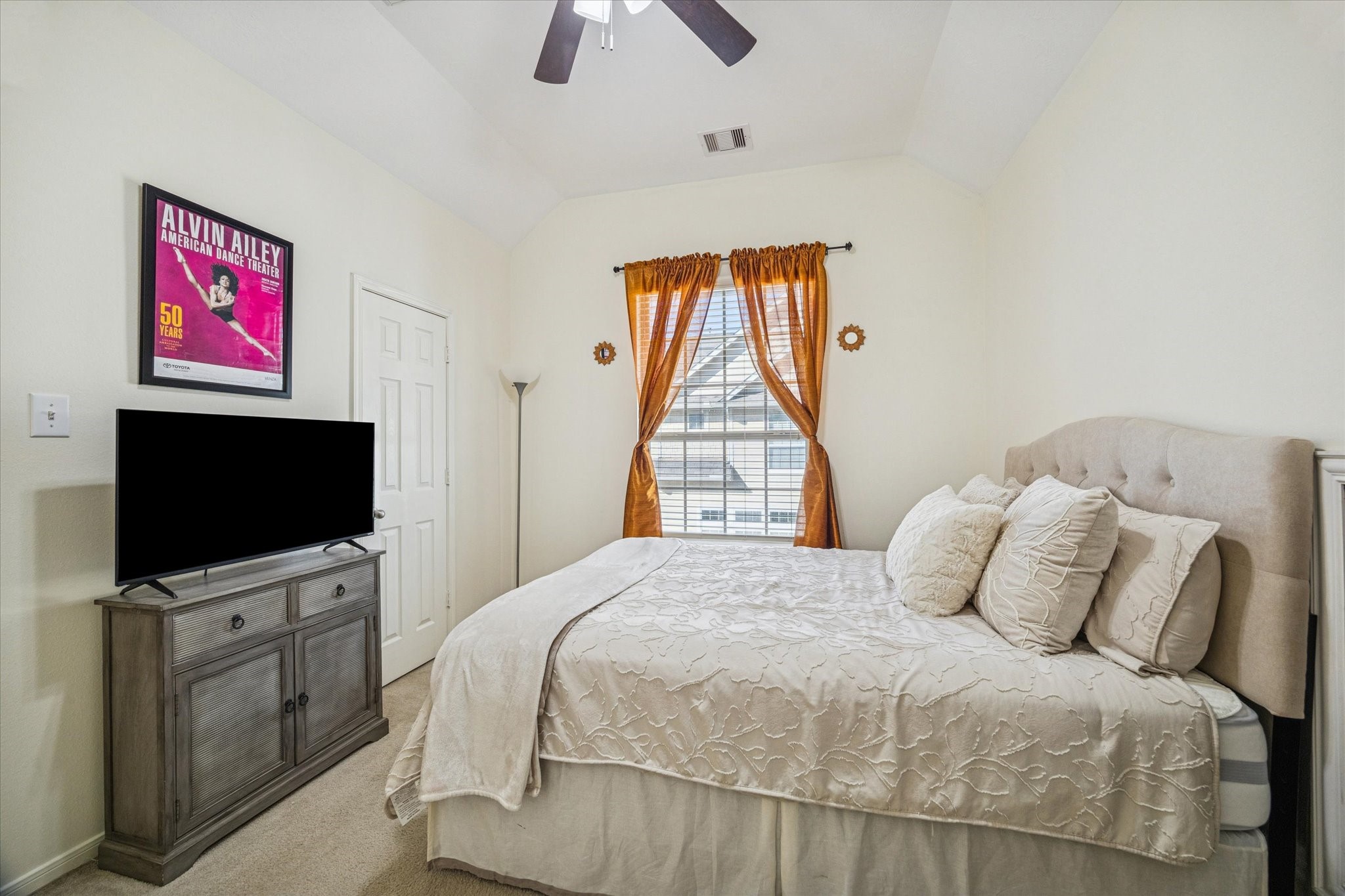 3332 Home Point Drive Houston, TX 77091 - Photo 21 of 26 a bedroom with a bed and a flat screen tv