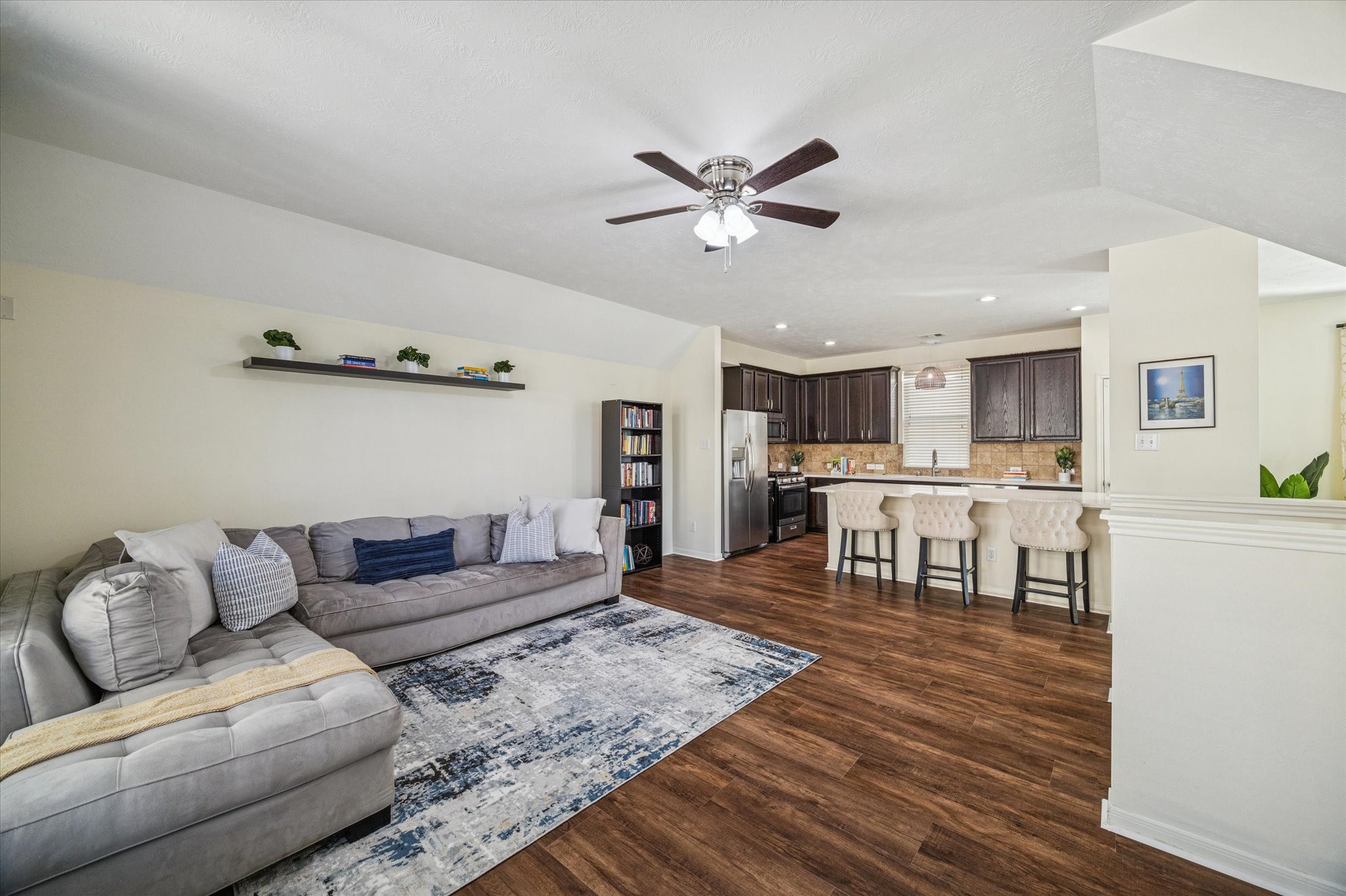 3332 Home Point Drive Houston, TX 77091 - Photo 10 of 26 a living room with furniture and a dining table with wooden floor