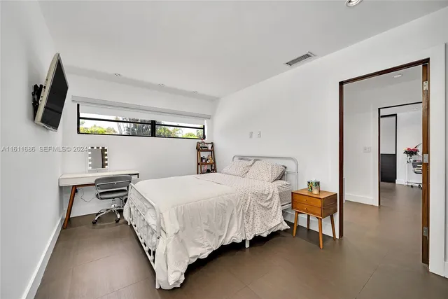 a bathroom with a toilet a sink and a mirror