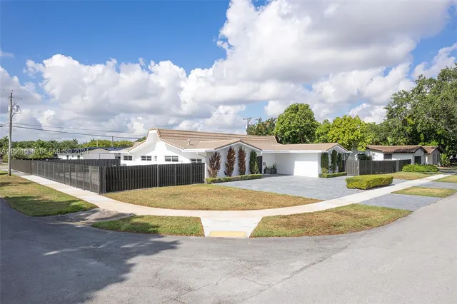 an aerial view of a house with swimming pool