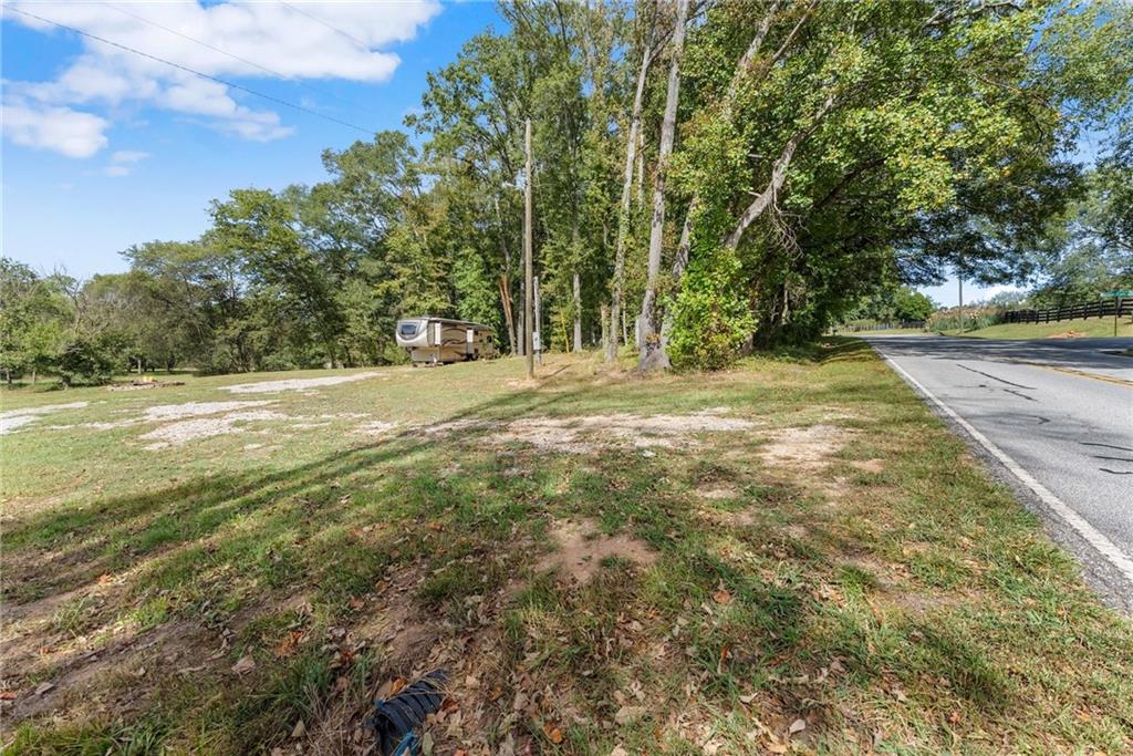 241 Bill Watkins Road Hoschton, GA 30548 - Photo 15 of 22 a view of a yard with a trees