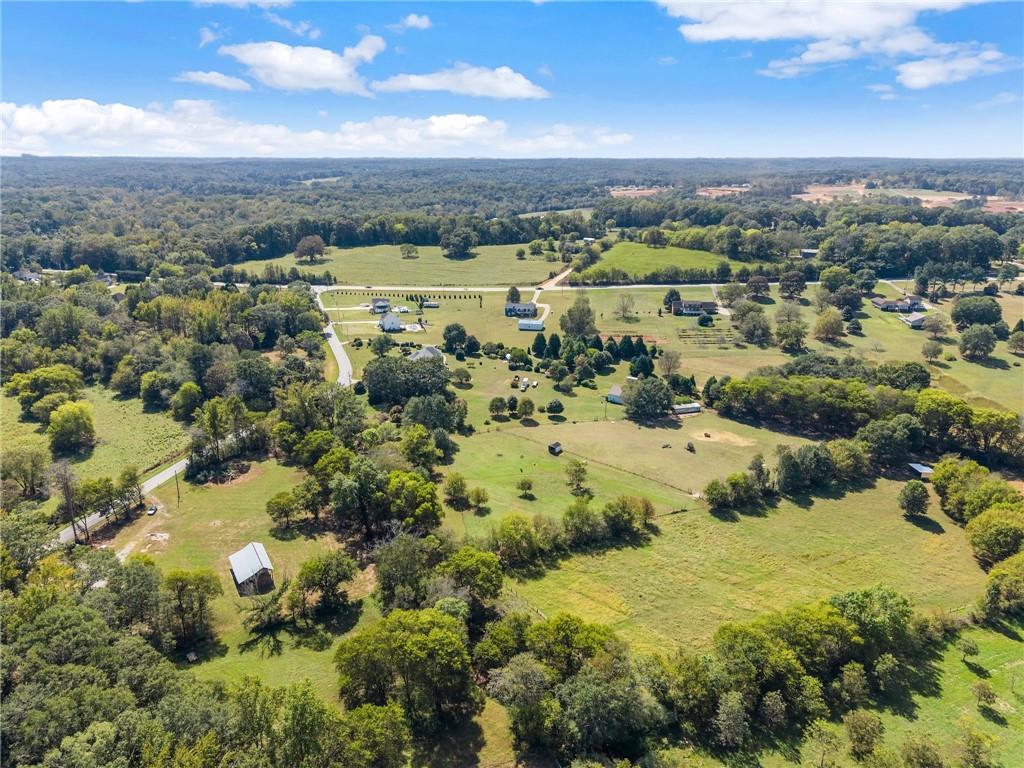 241 Bill Watkins Road Hoschton, GA 30548 - Photo 21 of 22 a view of a city with mountains in the background