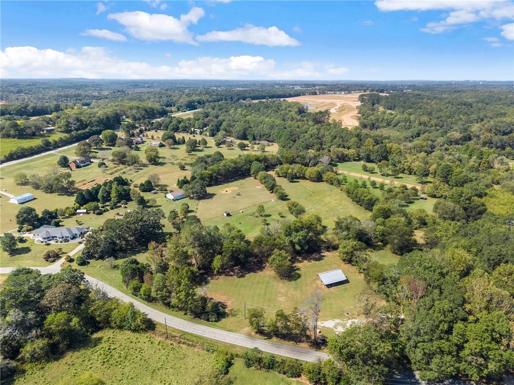 241 Bill Watkins Road Hoschton, GA 30548 - Photo 22 of 22 an aerial view of residential houses with outdoor space and trees