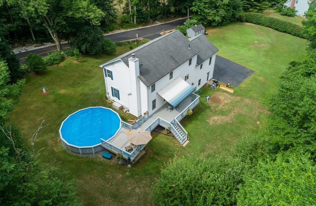 69 Babcock Tavern Road Ware, MA 01082 - Photo 3 of 42 an aerial view of a house with backyard swimming pool and outdoor seating