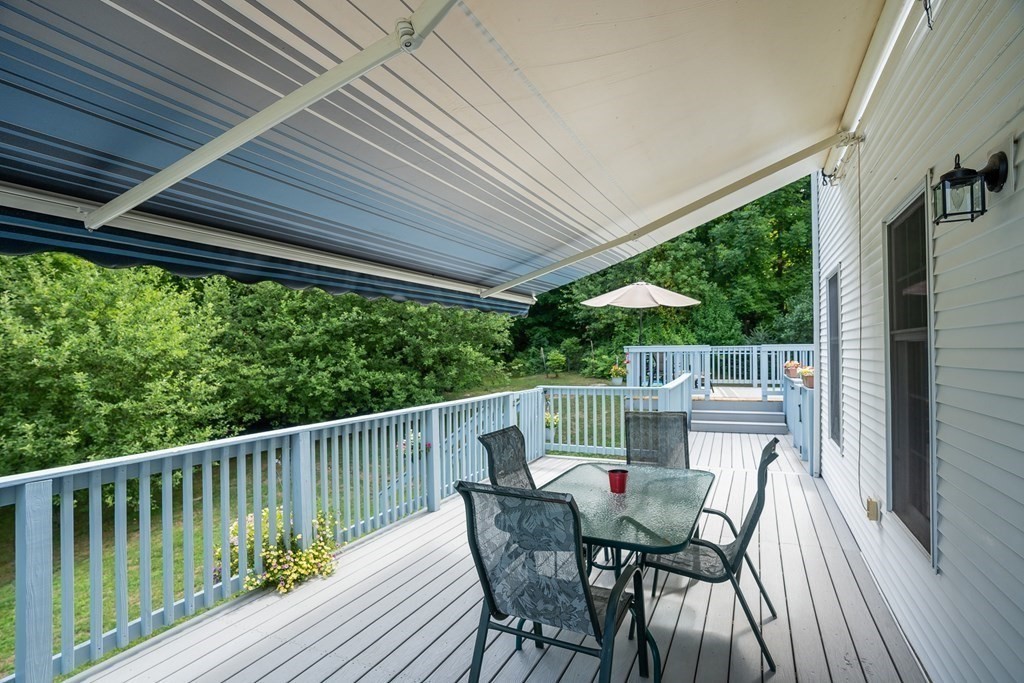 69 Babcock Tavern Road Ware, MA 01082 - Photo 8 of 42 a view of balcony with furniture and wooden deck