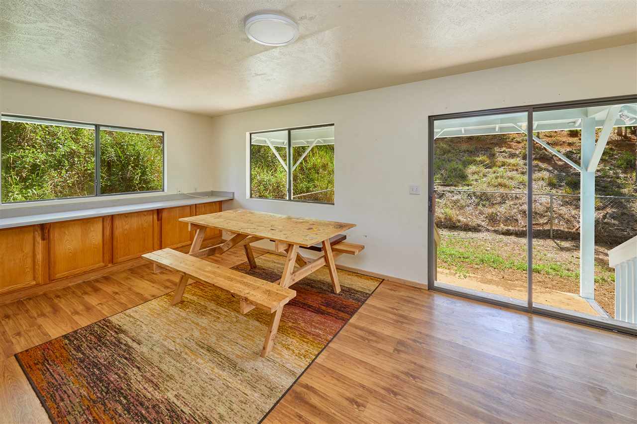 5 Piliwale Road Kula, HI 96790 - Photo 4 of 22 a living room with a couch and next to a window