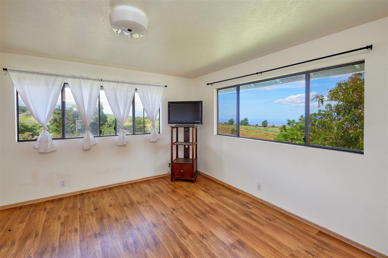 5 Piliwale Road Kula, HI 96790 - Photo 5 of 22 a view of a room with wooden floor and a window