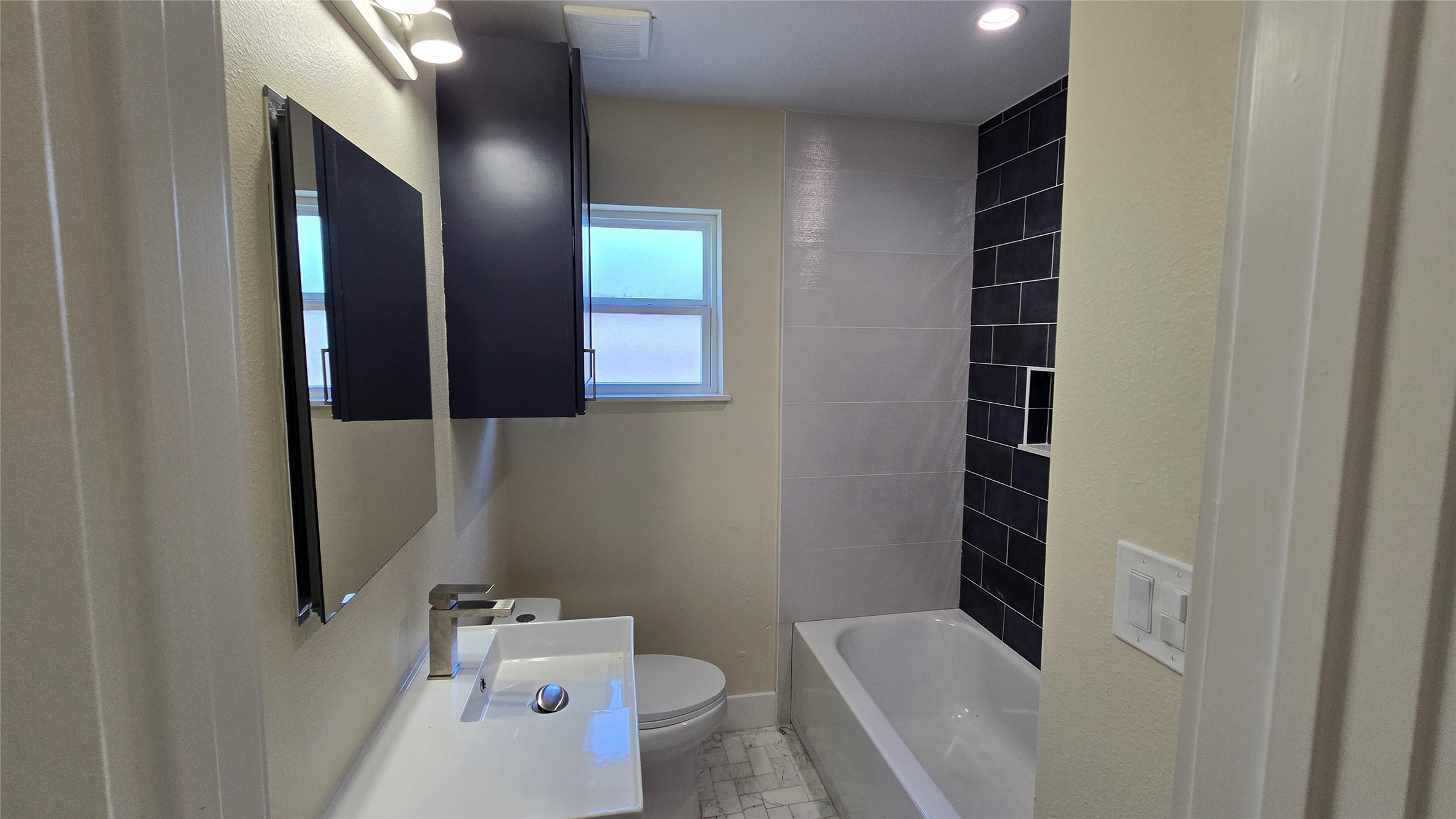 3741 Seabrook Street Houston, TX 77021 - Photo 10 of 50 a bathroom with a bathtub sink and toilet