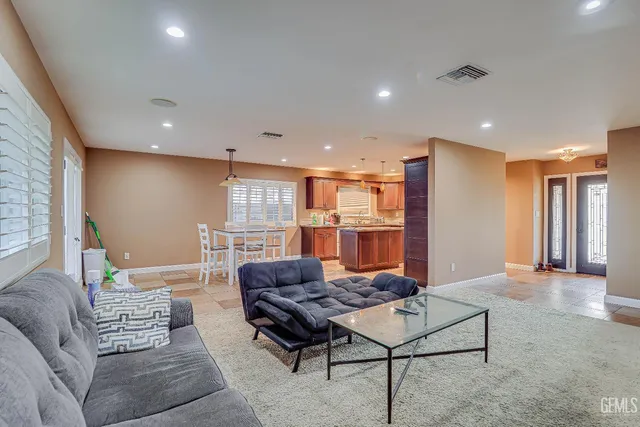 a living room with furniture and a table