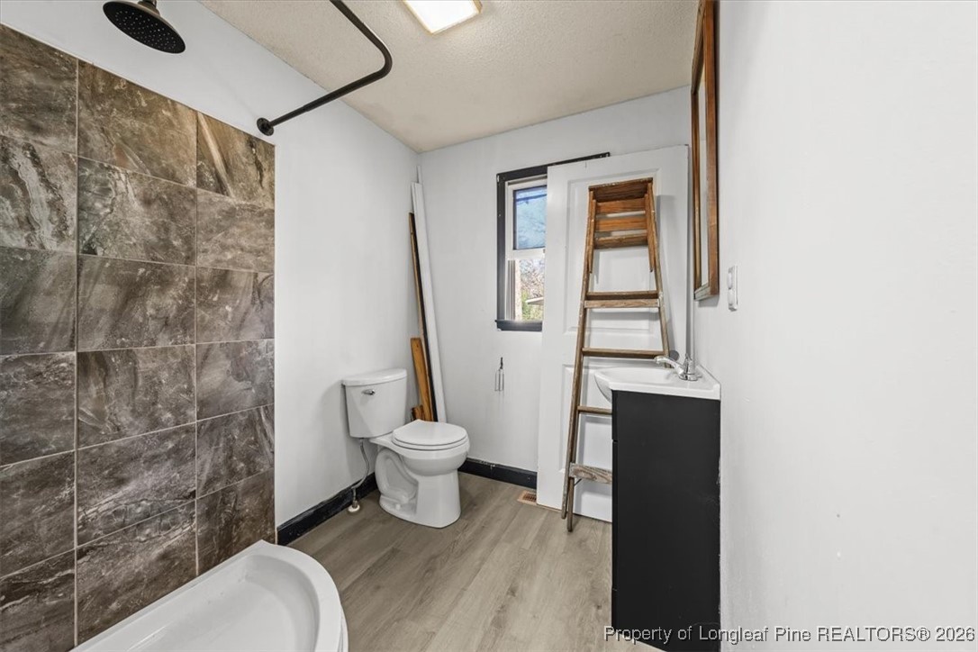 101 North Rockingham Street Robbins, NC 27325 - Photo 24 of 32 a bathroom with a toilet and a shower