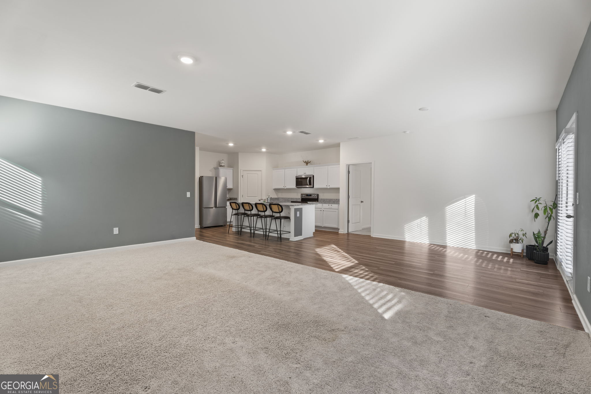 119 Bantry Way Locust Grove, GA 30248 - Photo 11 of 34 a view of a kitchen with a table and chairs