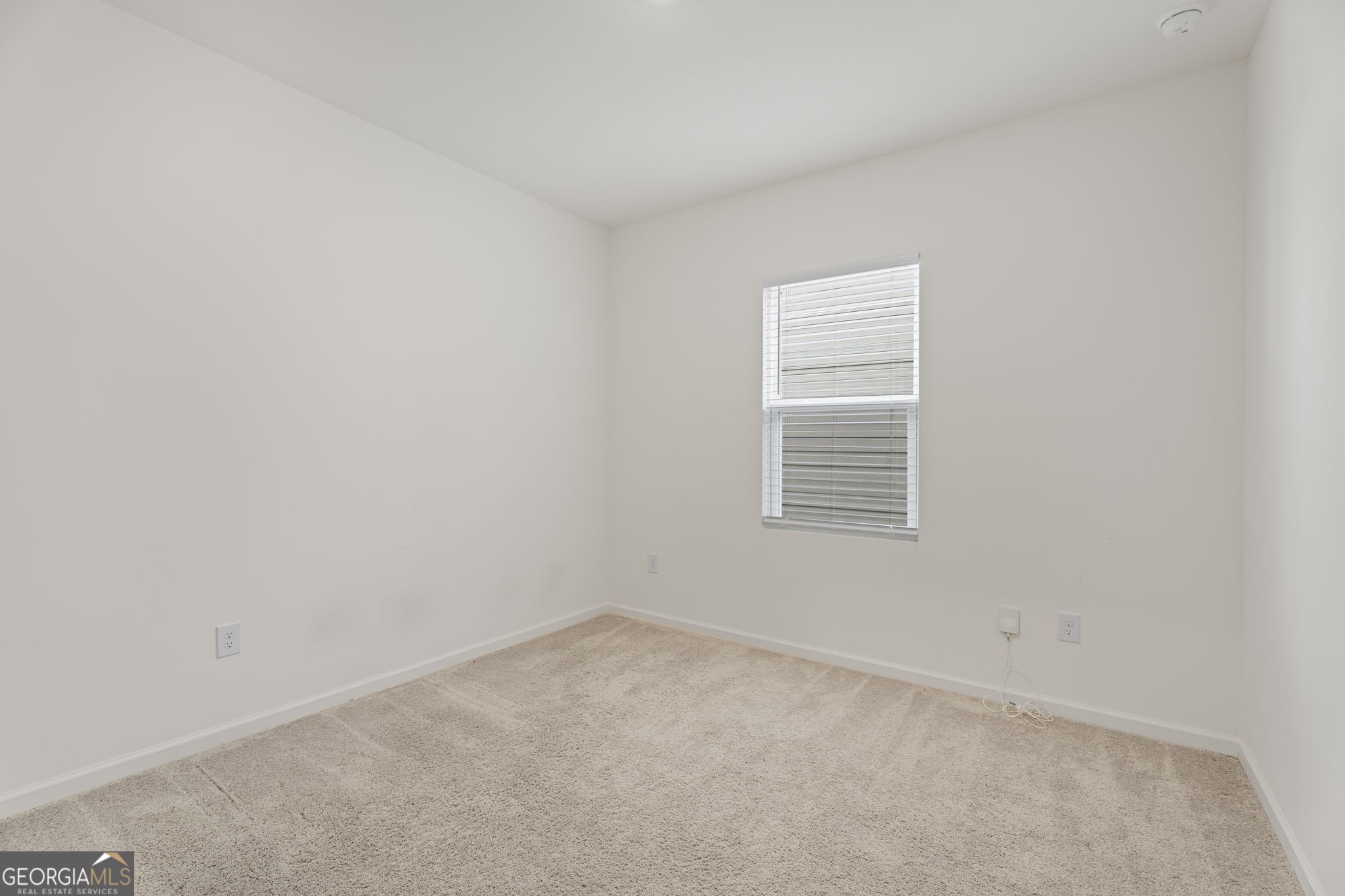 119 Bantry Way Locust Grove, GA 30248 - Photo 15 of 34 an empty room with a window