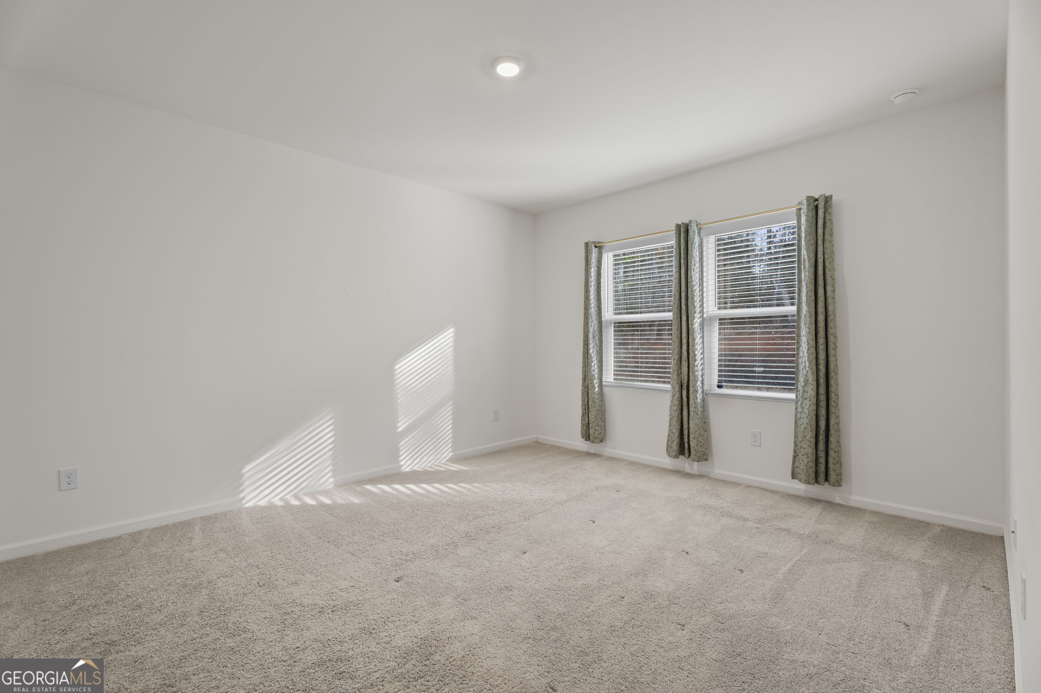 119 Bantry Way Locust Grove, GA 30248 - Photo 21 of 34 a view of an empty room with a window