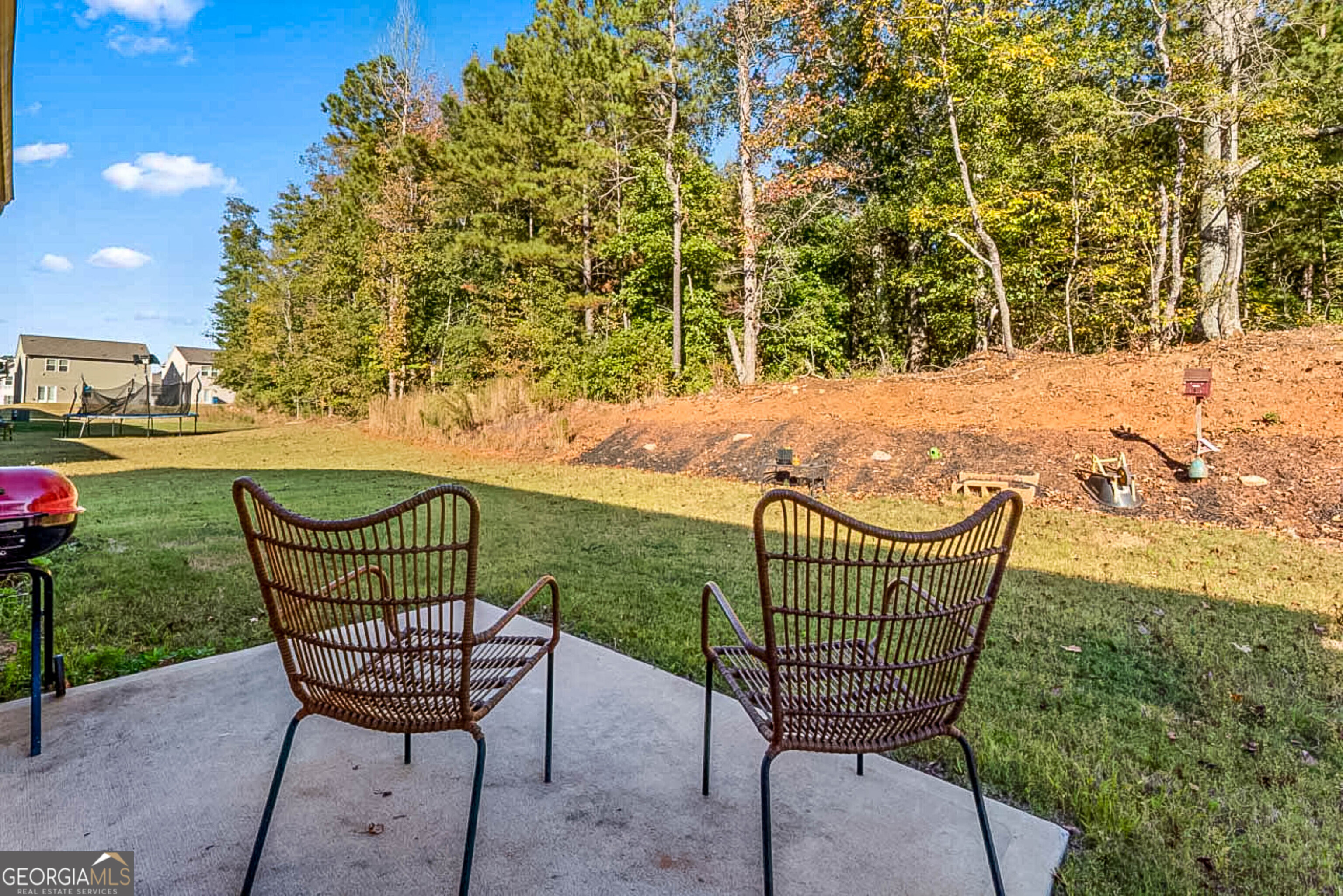 119 Bantry Way Locust Grove, GA 30248 - Photo 28 of 34 a view of a chair and table in the patio