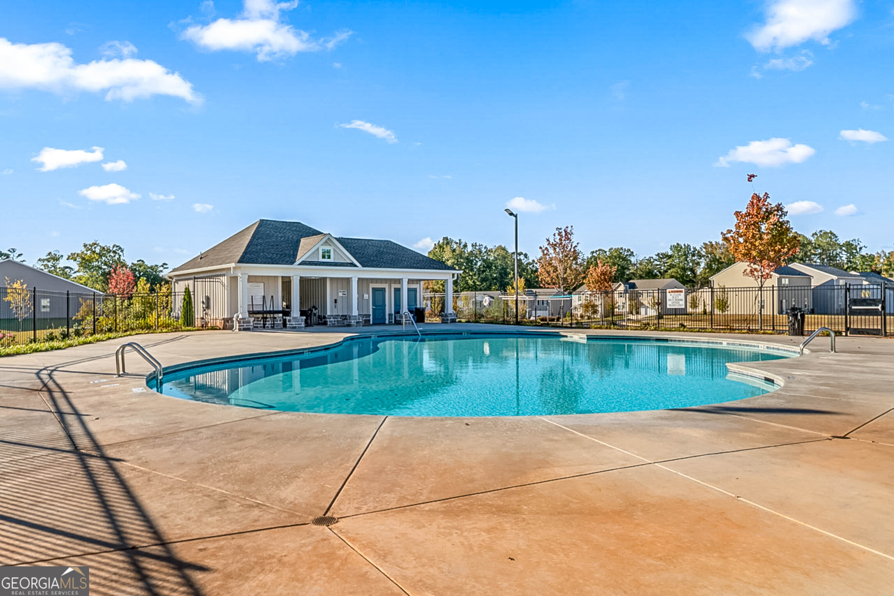 119 Bantry Way Locust Grove, GA 30248 - Photo 33 of 34 a view of a swimming pool with a yard and a fire pit