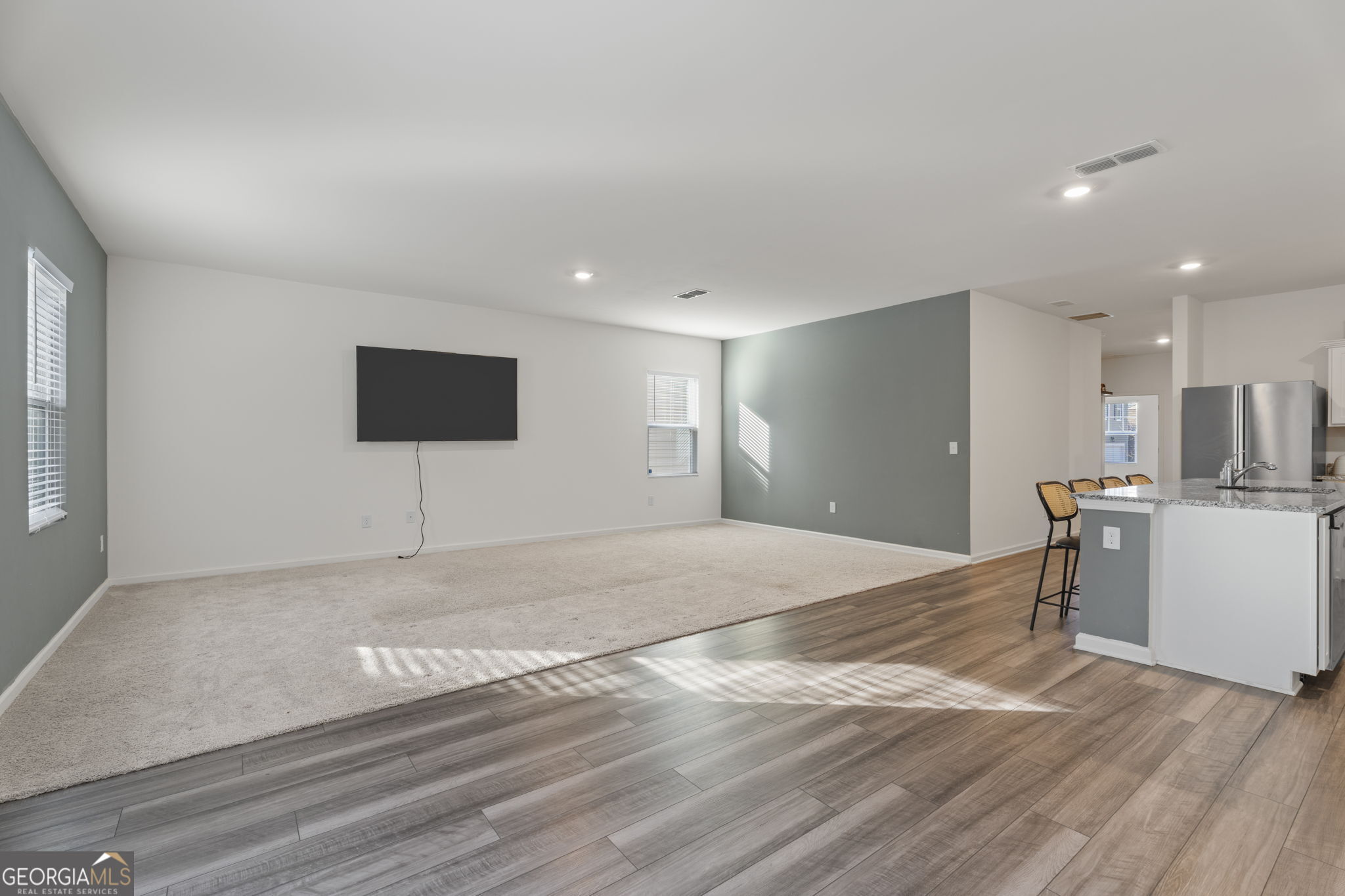119 Bantry Way Locust Grove, GA 30248 - Photo 10 of 34 a view of empty room with wooden floor and fan