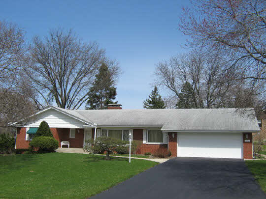 1210 Sequoia Road Rockford, IL 61108 - Photo 1 of 11 a view of house with a yard