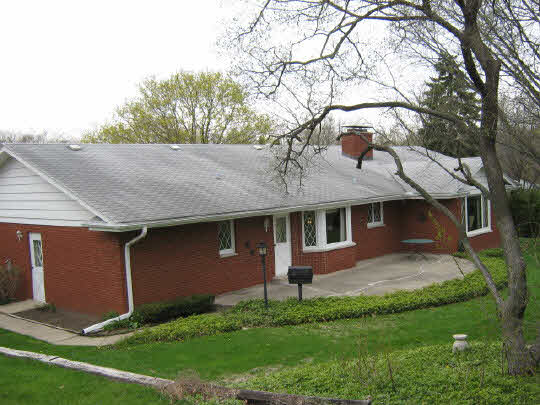 1210 Sequoia Road Rockford, IL 61108 - Photo 11 of 11 a front view of a house with a yard and garage