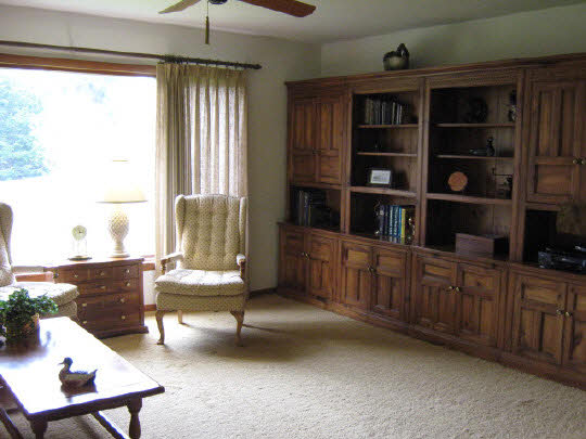1210 Sequoia Road Rockford, IL 61108 - Photo 5 of 11 a living room with furniture and a book shelf