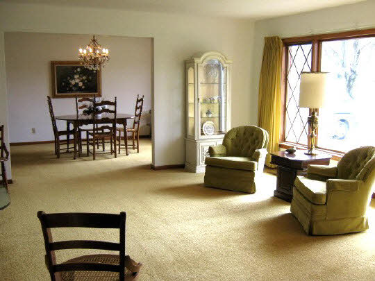 1210 Sequoia Road Rockford, IL 61108 - Photo 6 of 11 a living room with furniture and a chandelier