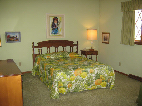 1210 Sequoia Road Rockford, IL 61108 - Photo 10 of 11 a bed sitting in a bedroom next to a window