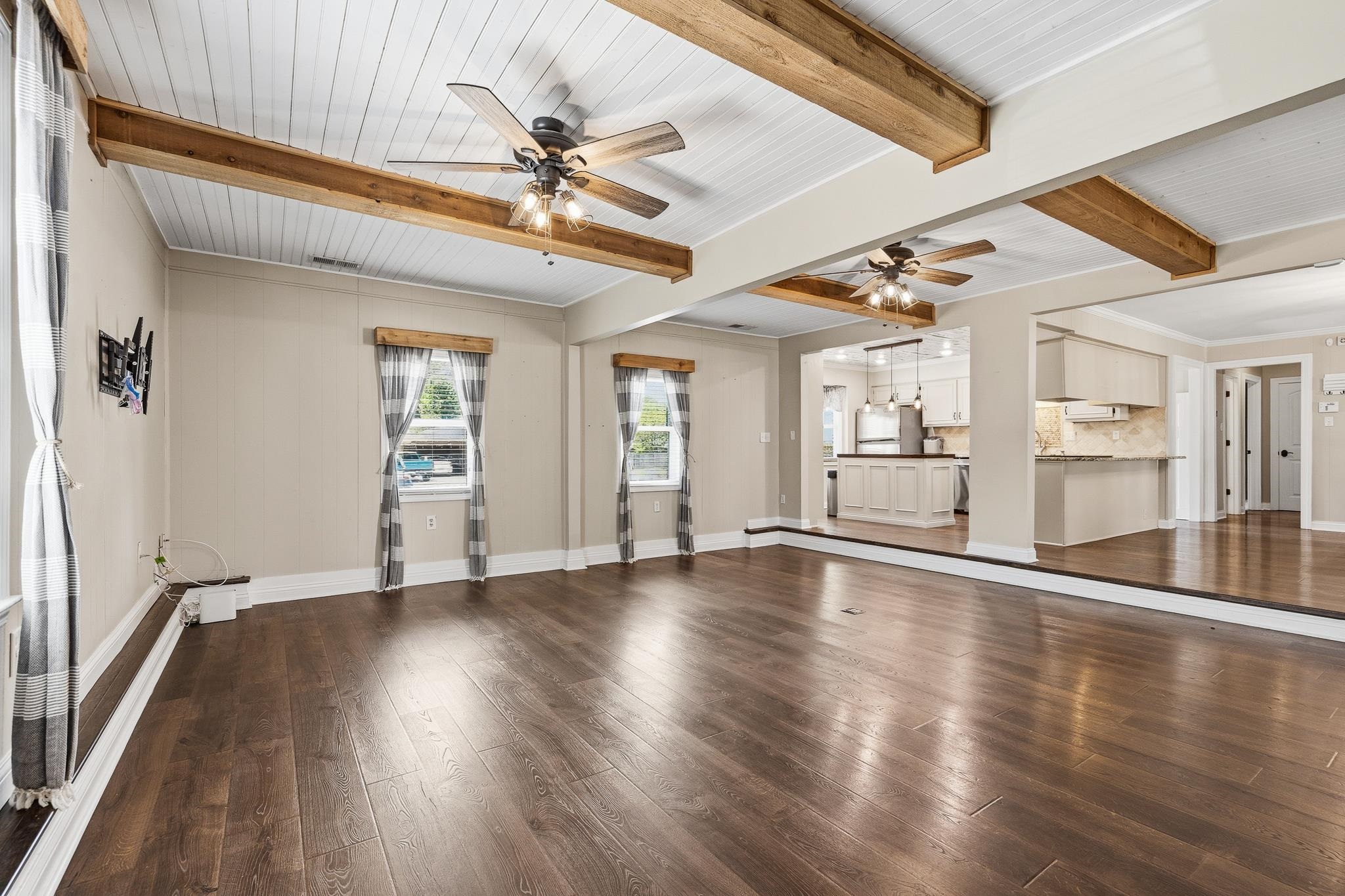 1234 Greenview Road Collierville, TN 38017 - Photo 8 of 33 a view of an empty room with wooden floor and a window