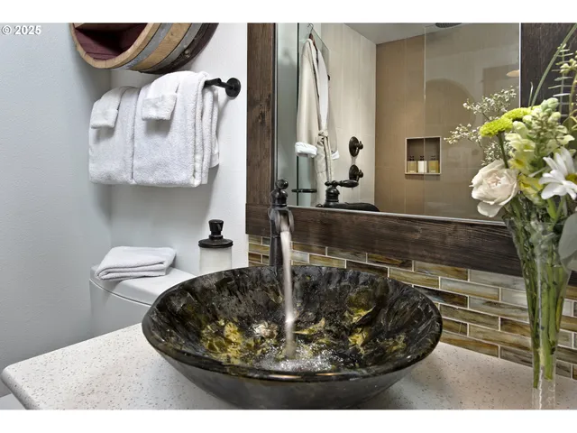 a bedroom with furniture and a fireplace