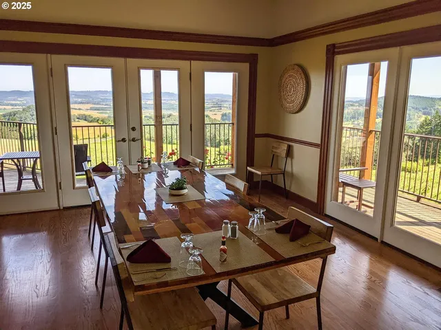 a view of a house with a yard and sitting area