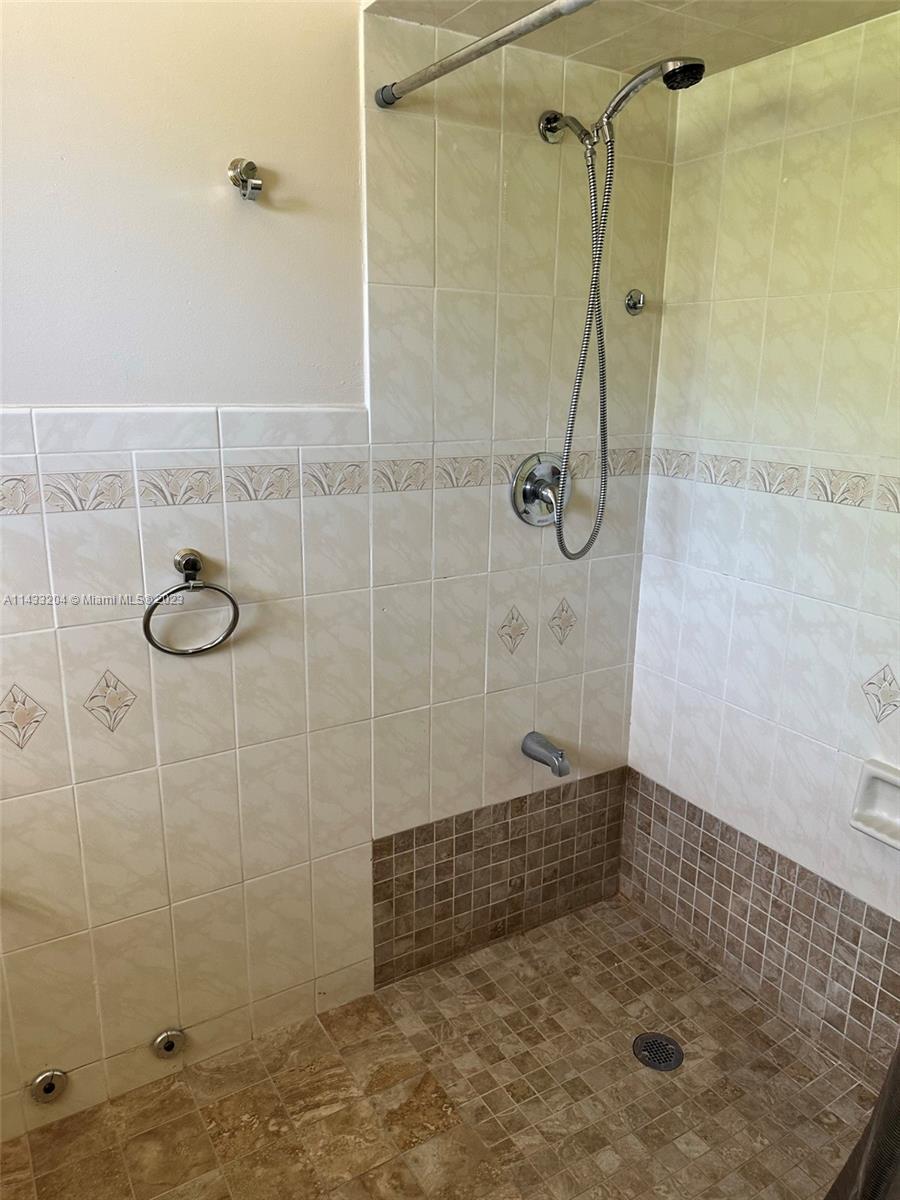 9110 Southwest 9th Terrace, Unit 9110 Miami, FL 33174 - Photo 14 of 17 a bathroom with a shower