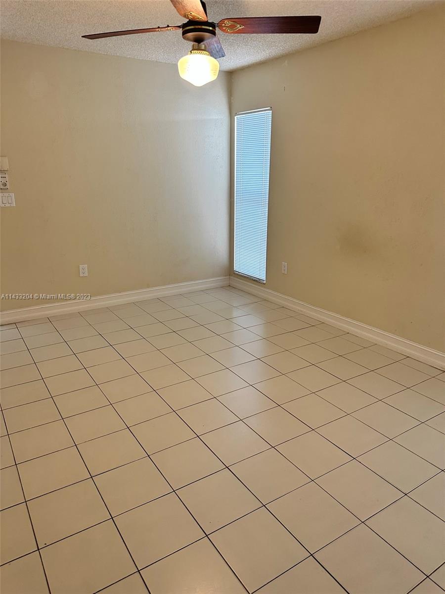 9110 Southwest 9th Terrace, Unit 9110 Miami, FL 33174 - Photo 9 of 17 a view of an empty room